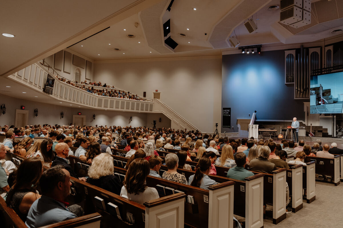The sanctuary full during a service, seen from the balcony.