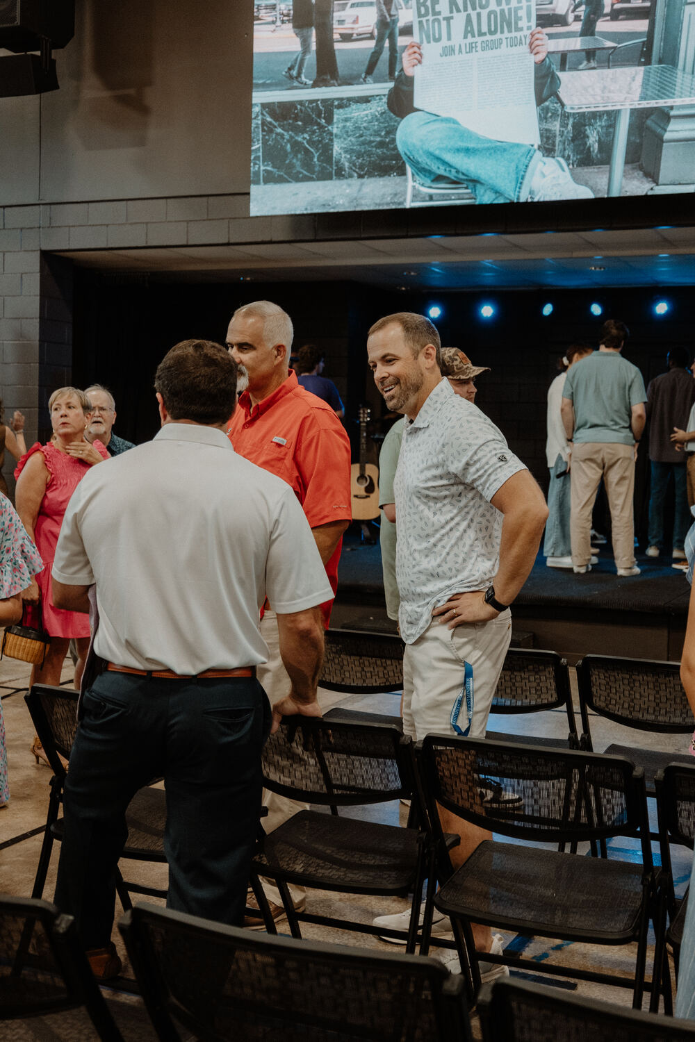 Men talking together after a service.