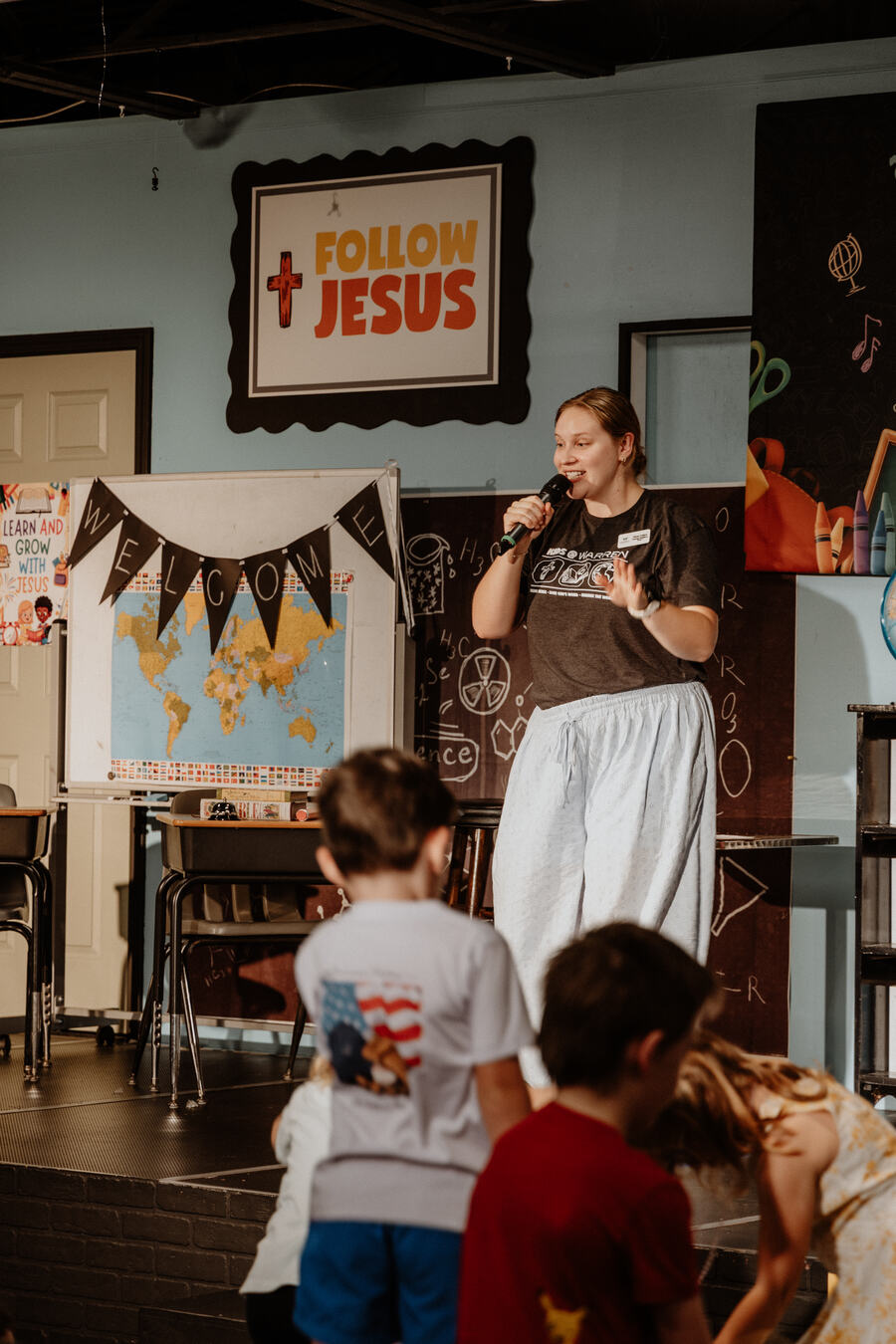 A leader teaching in a kids classroom.
